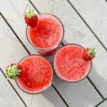 frozen strawberry margarita on the picnic table