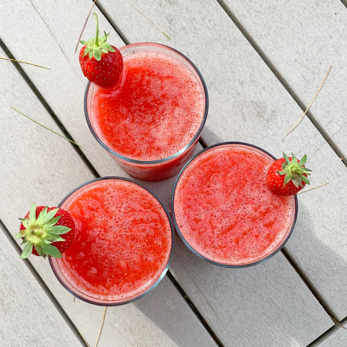 frozen strawberry margarita on the picnic table