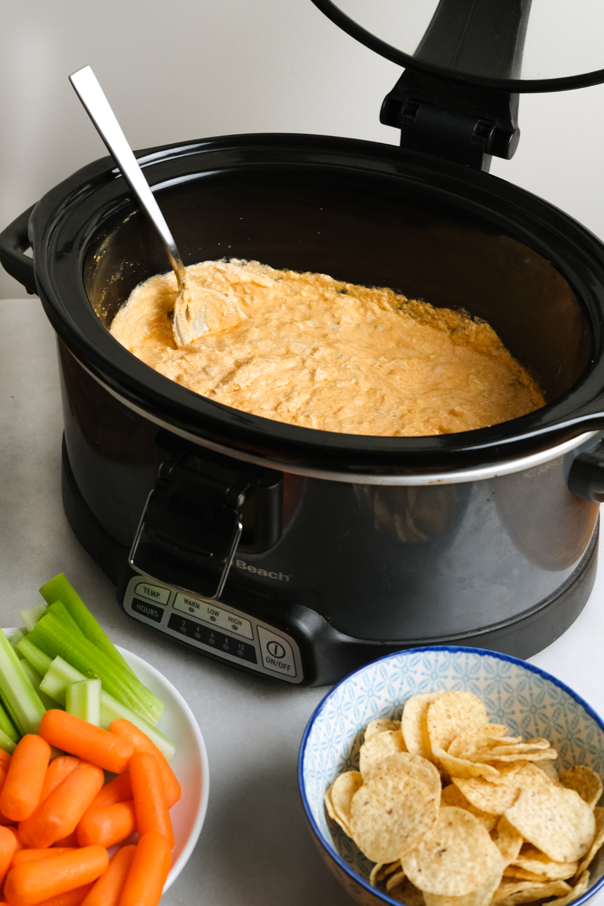 buffalo chicken dip with chips and veggies