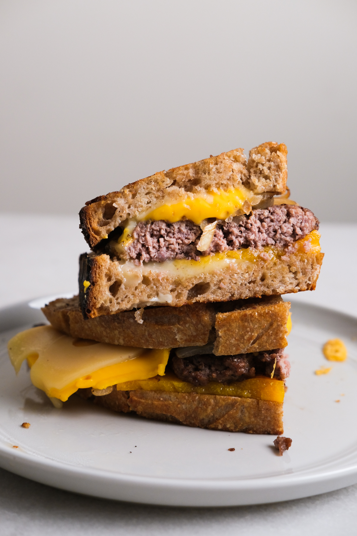 side view of patty melt on a plate