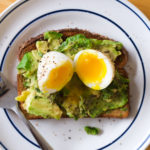 avocado toast with soft boiled egg cut open