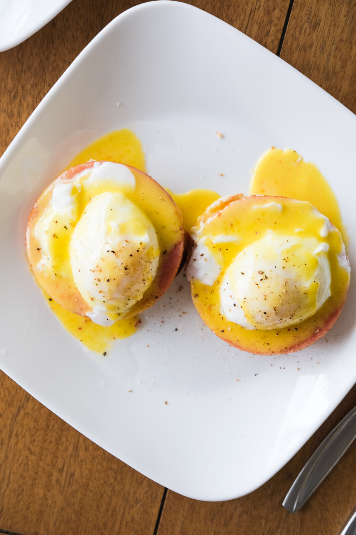 plate of eggs benedict with hollandaise