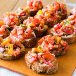 serving slices of bruschetta with fresh tomatoes and basil