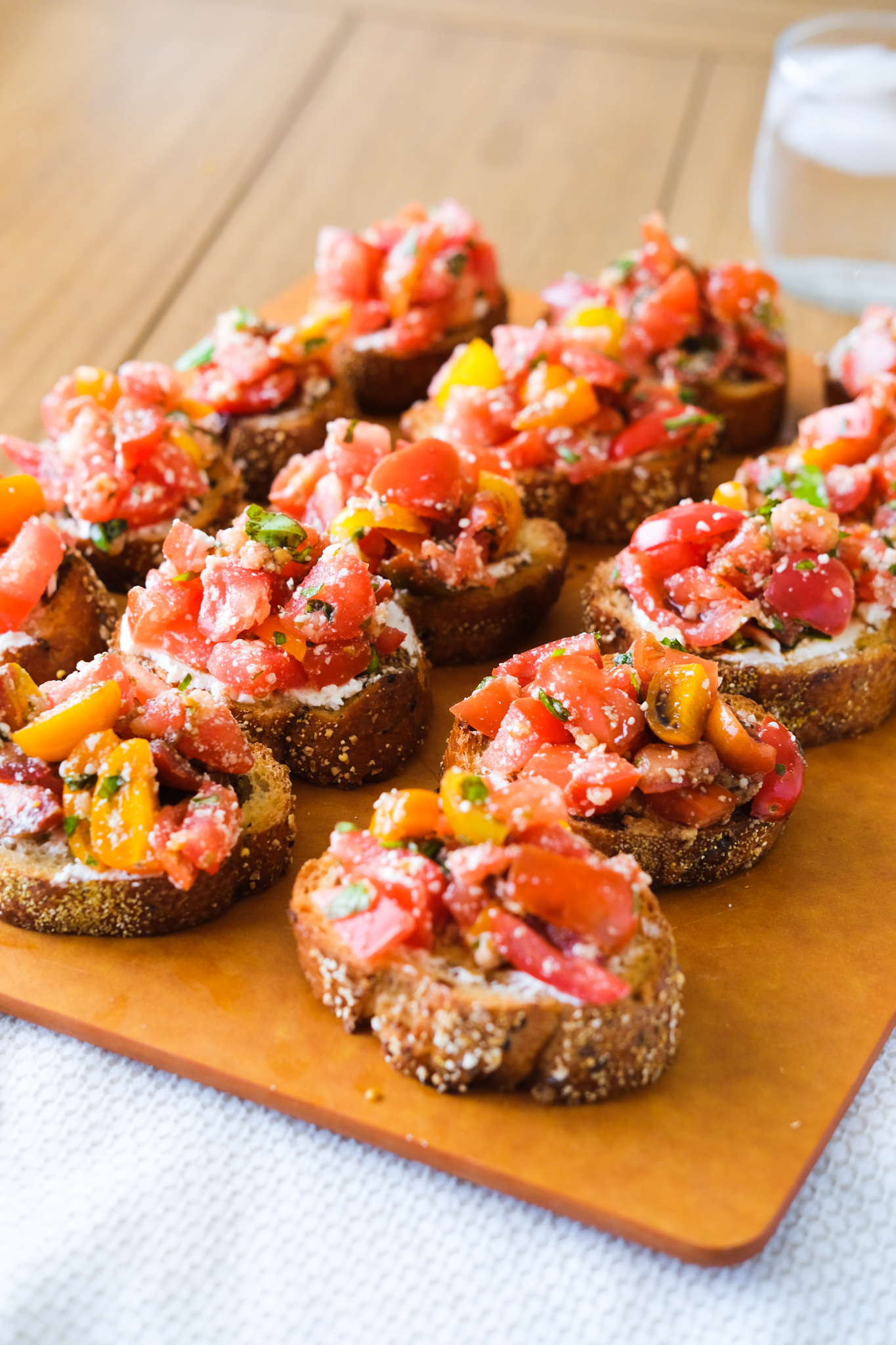serving slices of bruschetta with fresh tomatoes and basil