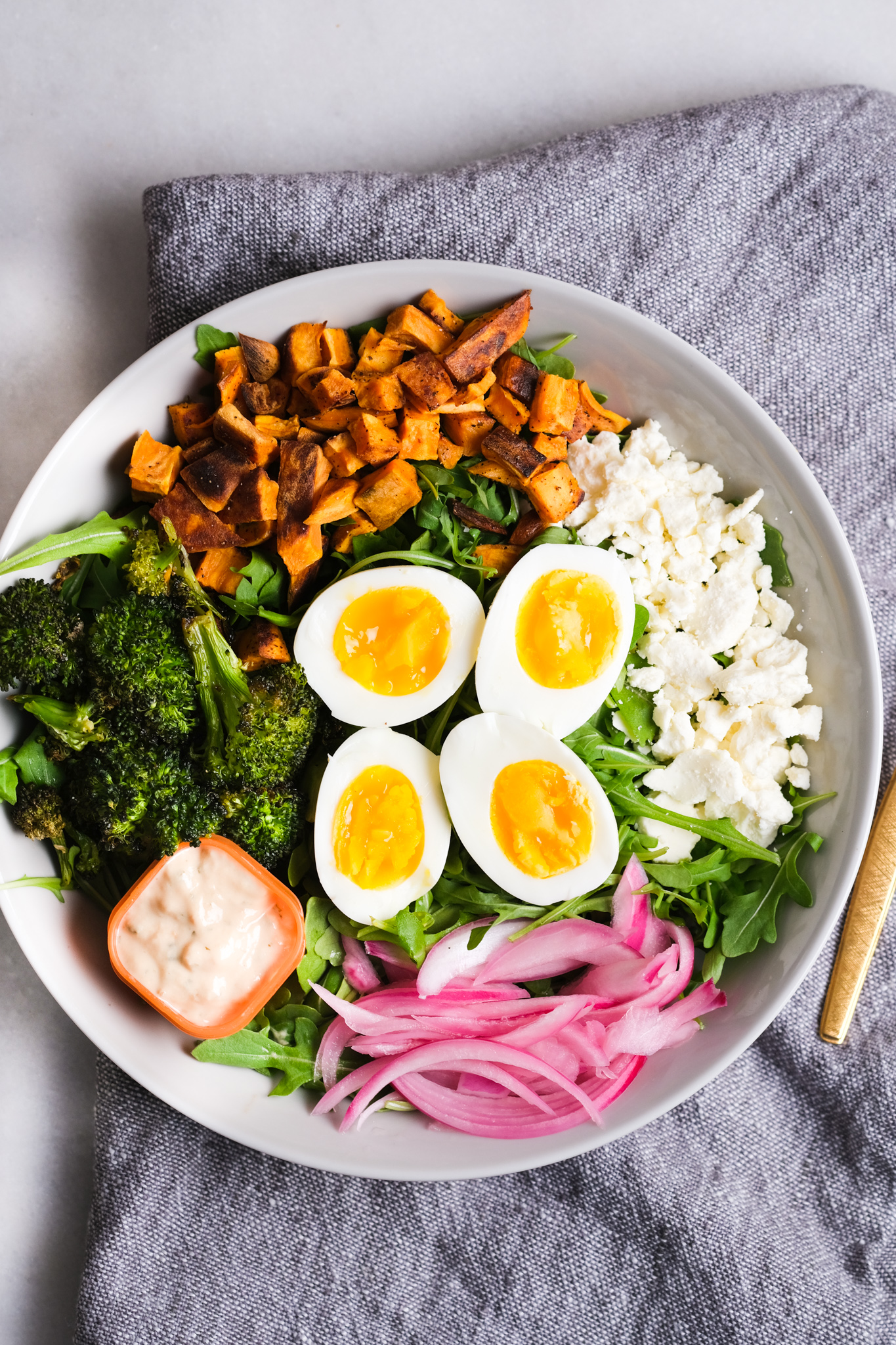 arugula lunch bowl with colorful ingredients