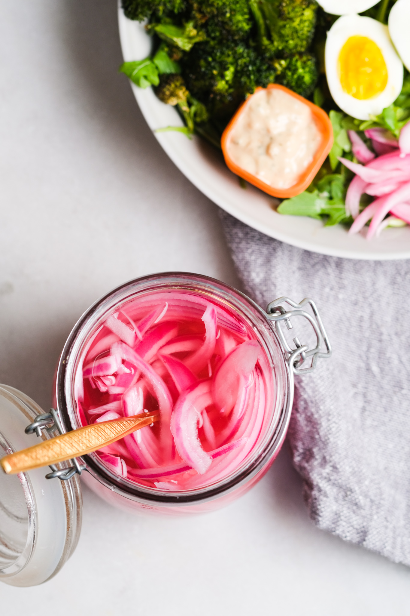 fork in a jar of quick pickled red onions