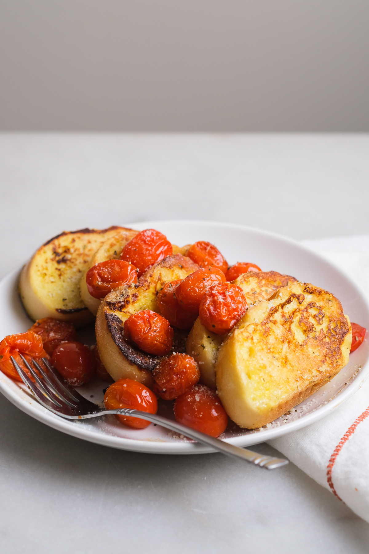 savory french toast with cherry tomatoes on a plate