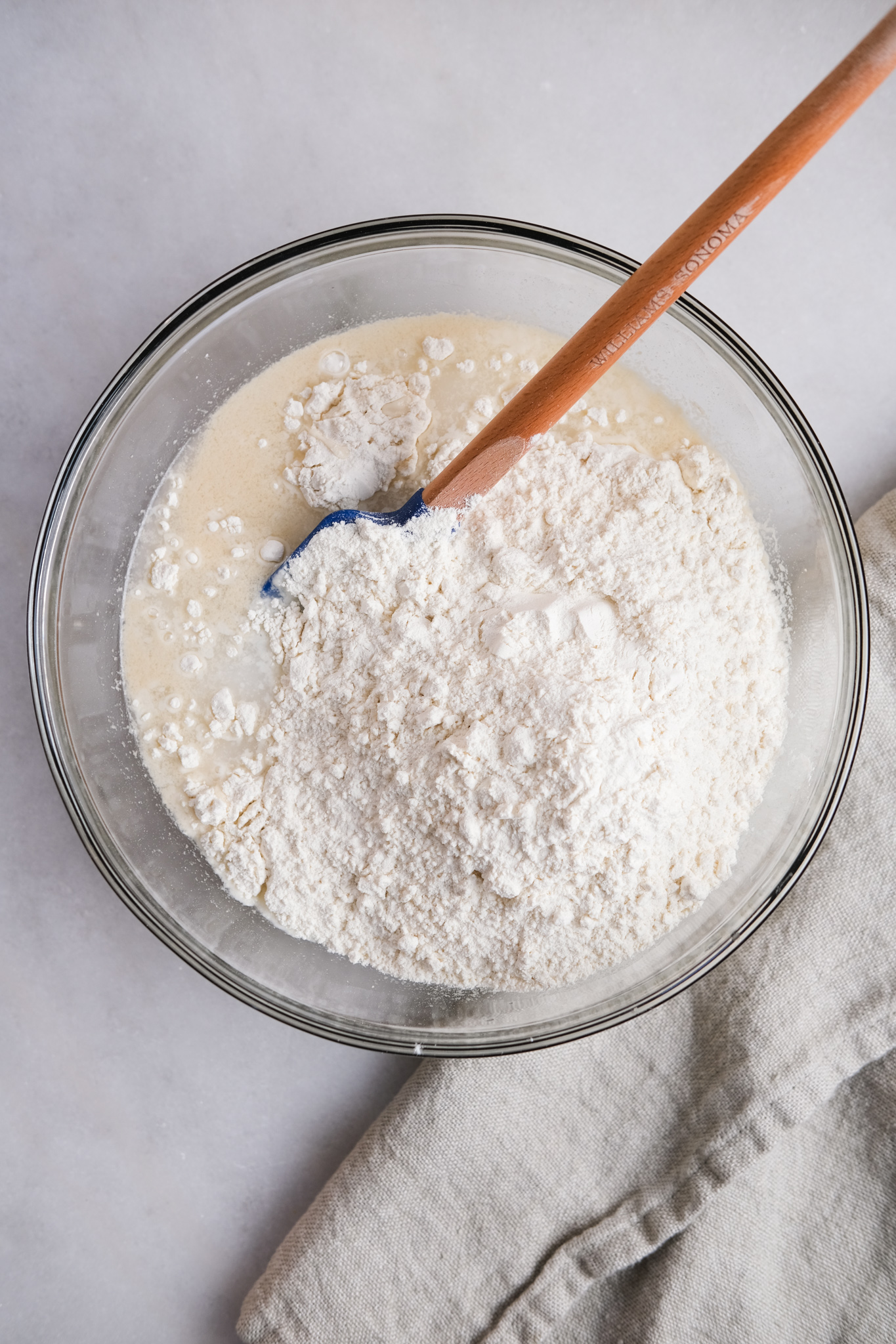 mixing flour into water and sourdough starter