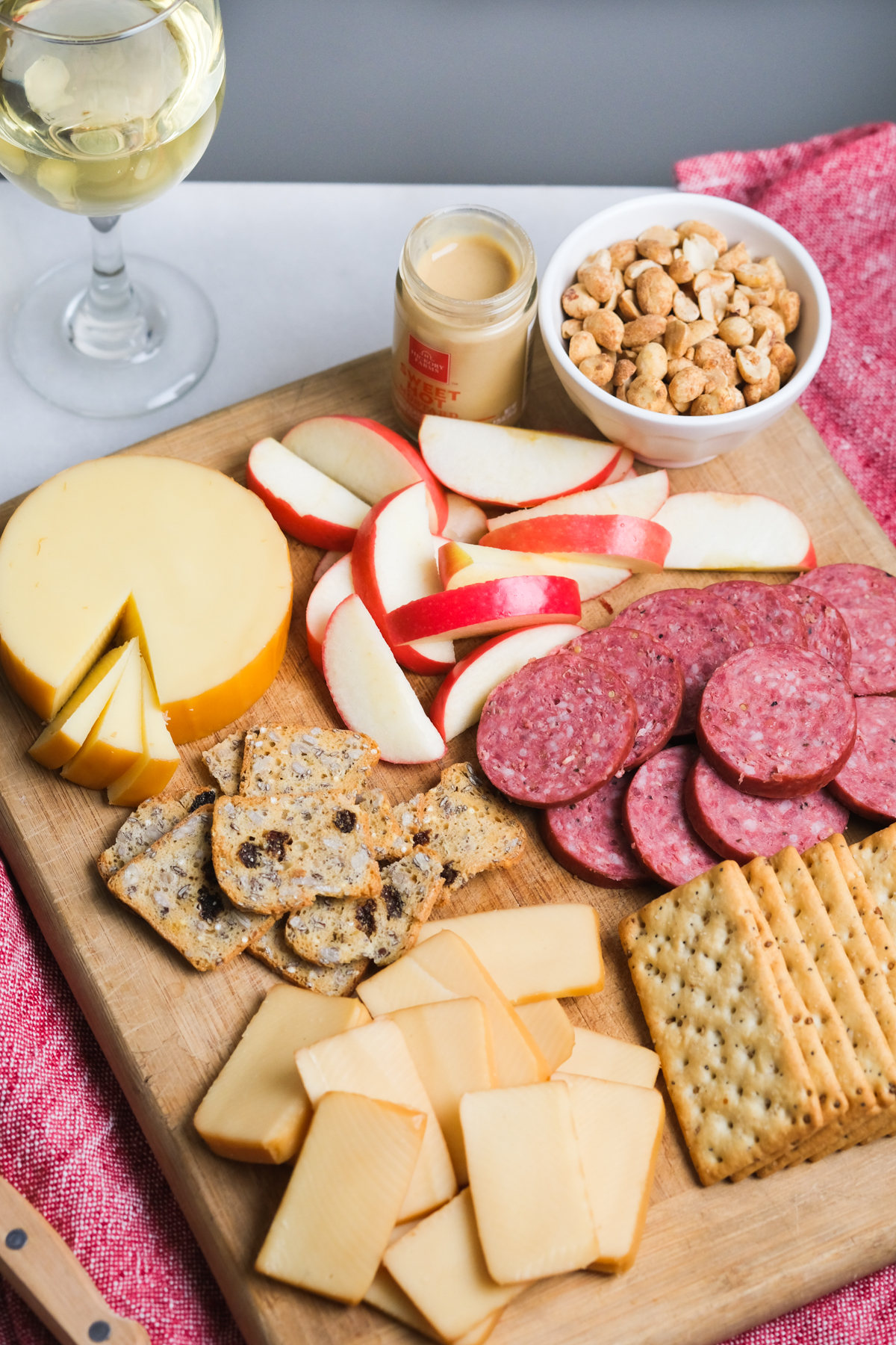 easy cheese board with glass of white wine