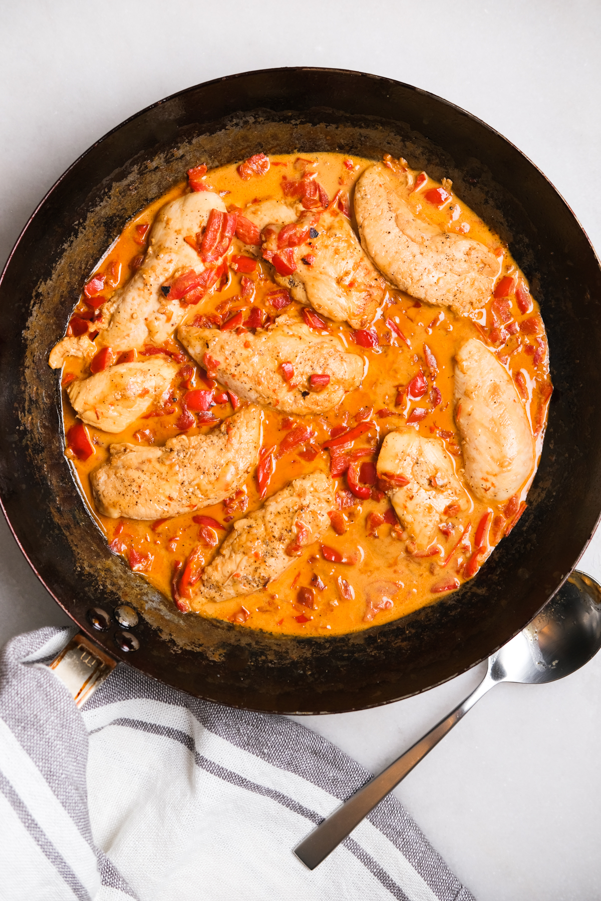 creamy roasted red pepper chicken in a skillet