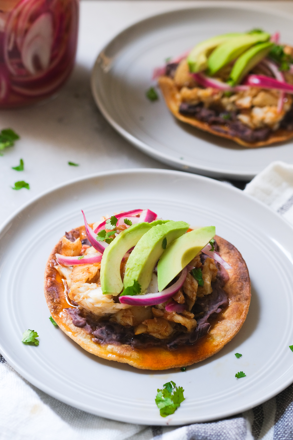 tostadas with pickled onions and avocado