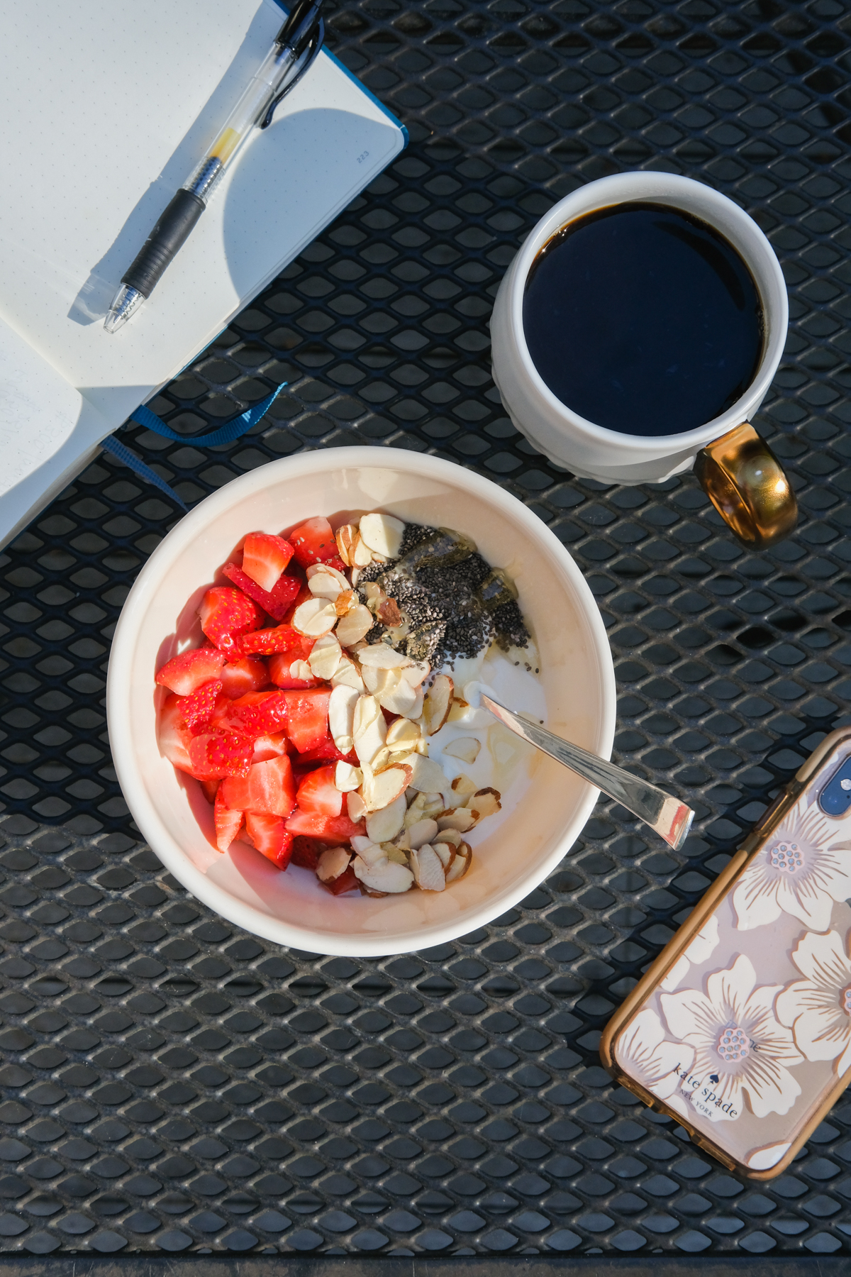 strawberries in a greek yogurt bowl on the deck