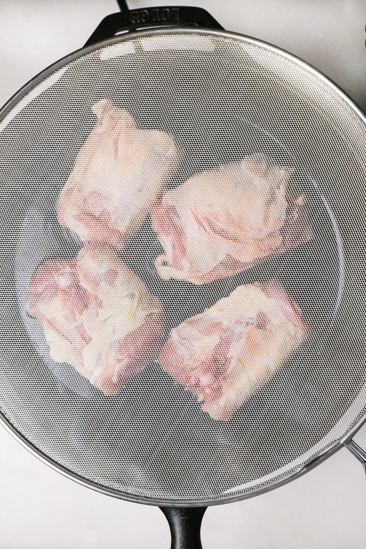 covering chicken thighs with grease protector