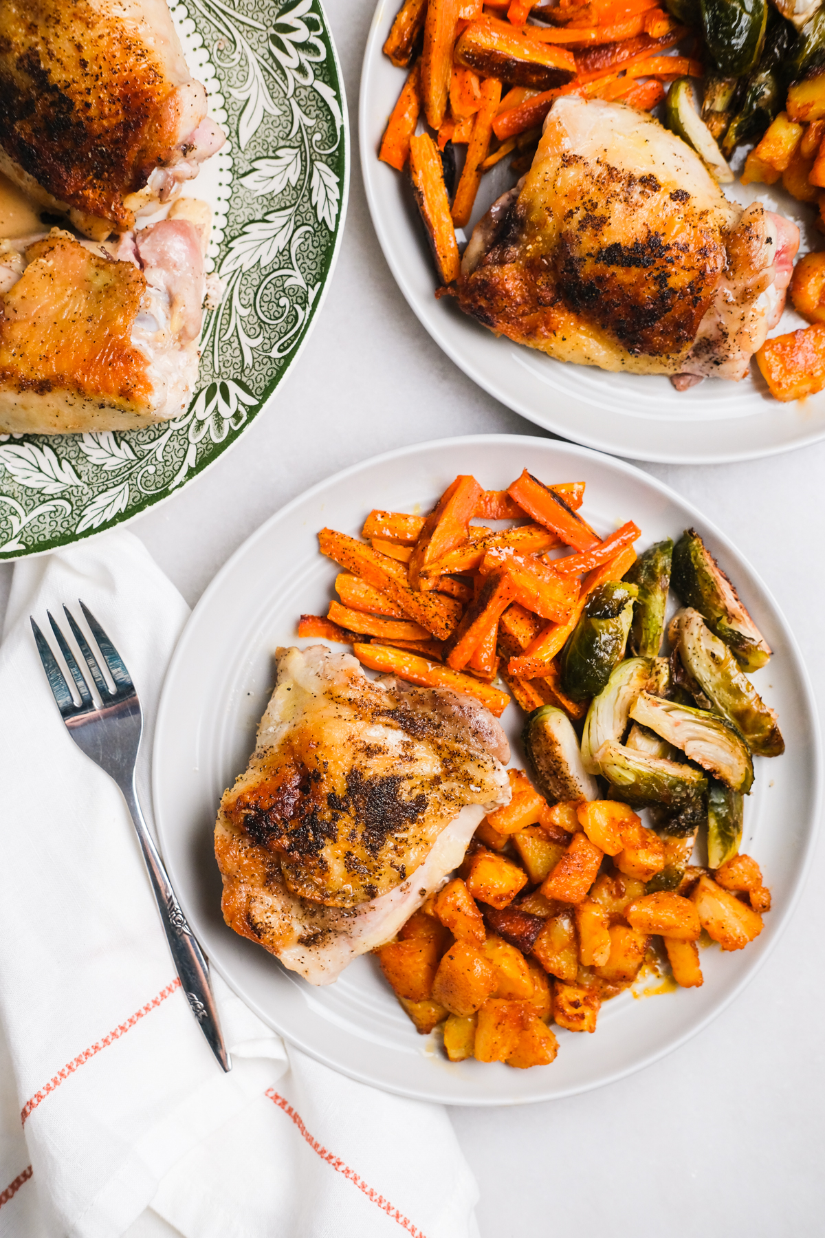 chicken thigh dinner with roasted vegetables and potatoes