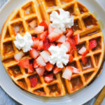protein waffle with strawberries and whipped cream