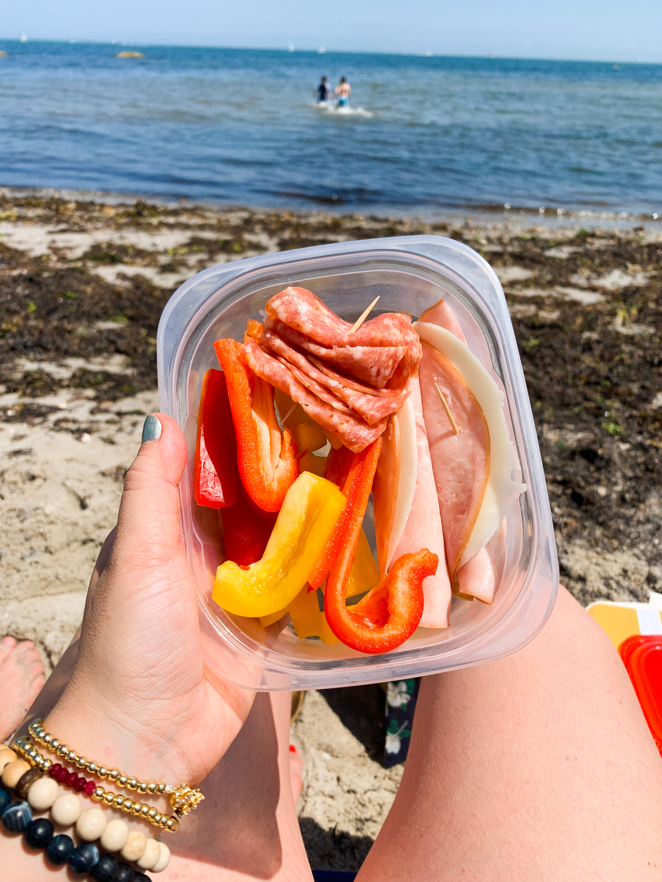 lunch snack plate on the beach with deli slices and bell peppers
