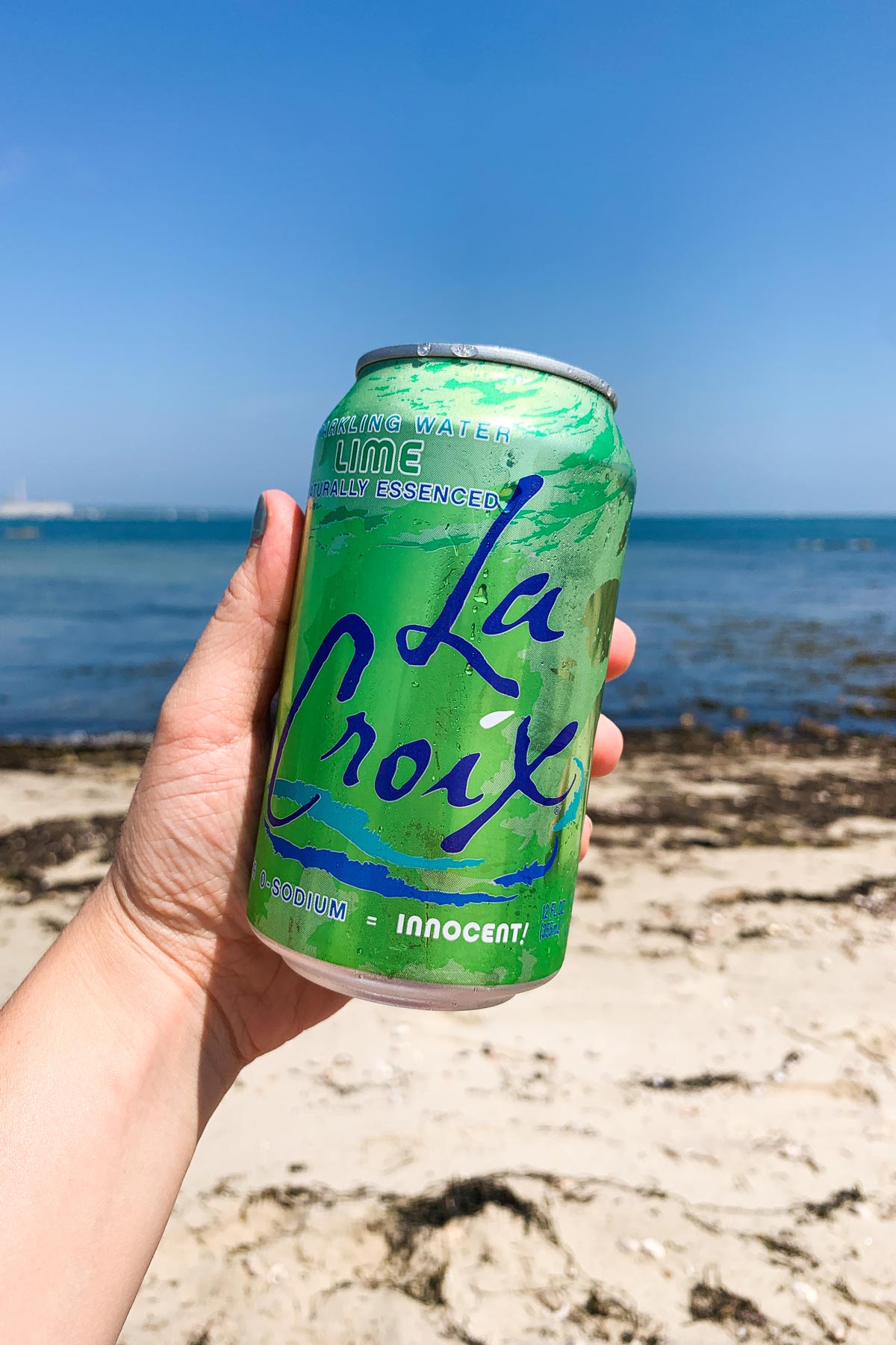 sparkling water in a can on the beach