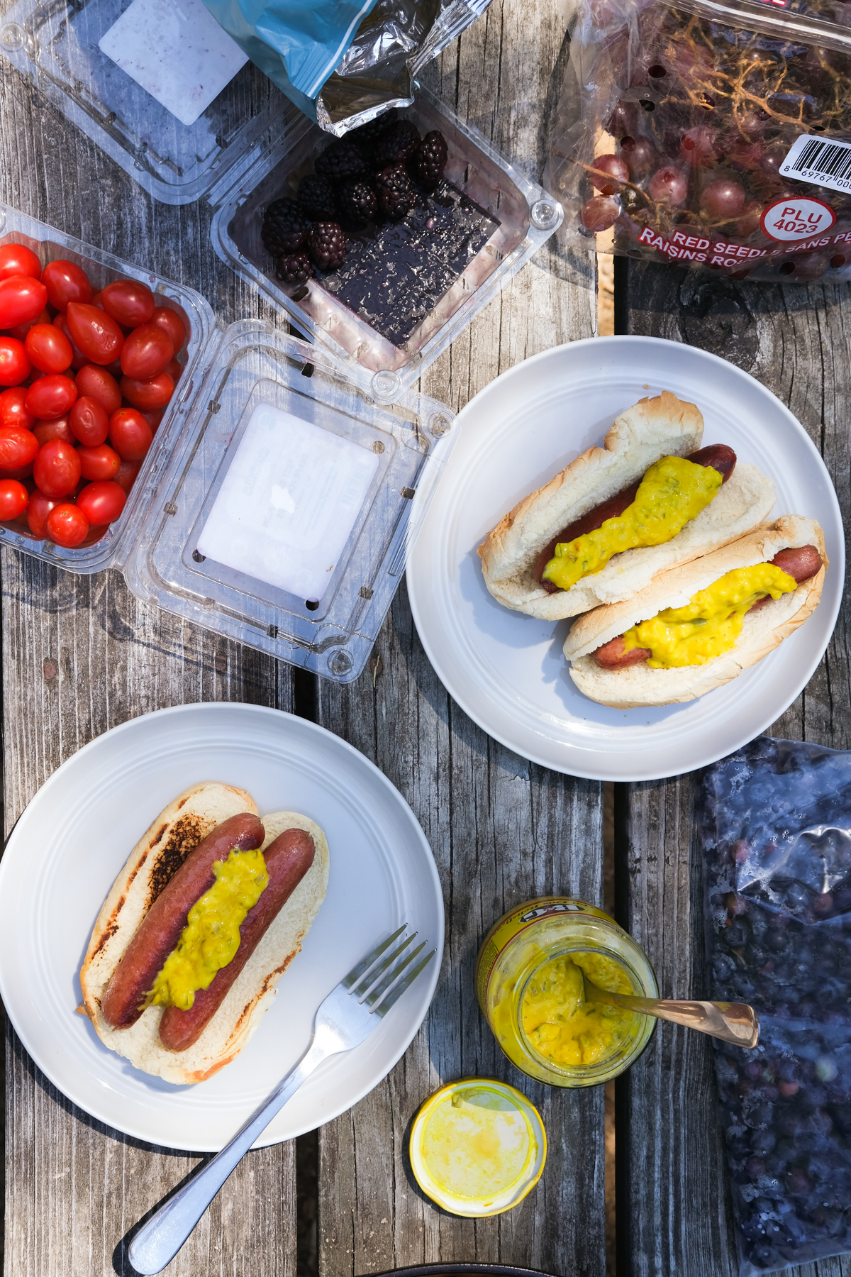 hot dogs with hot dog relish and fruits with lunch