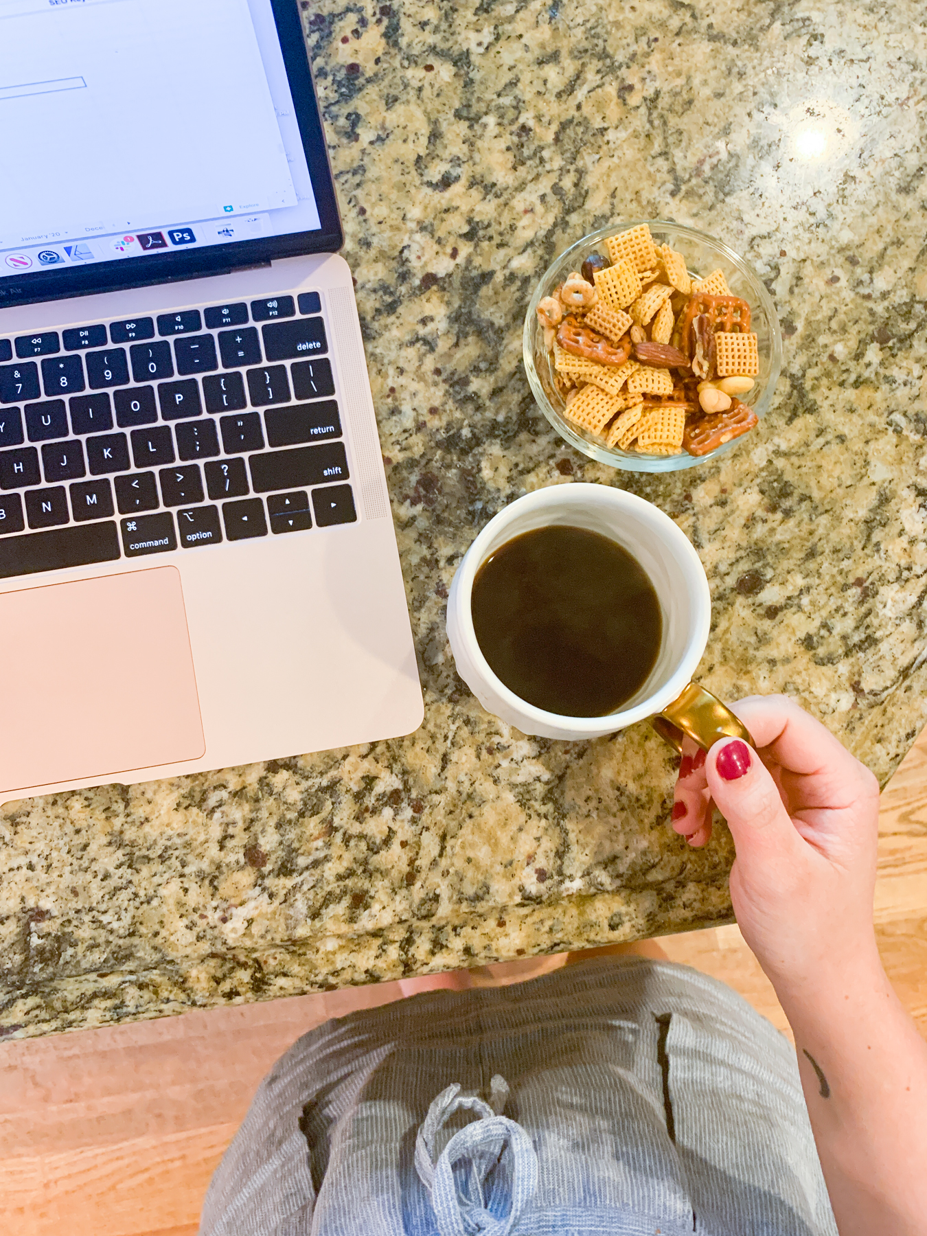 chex mix and coffee with a laptop on the counter