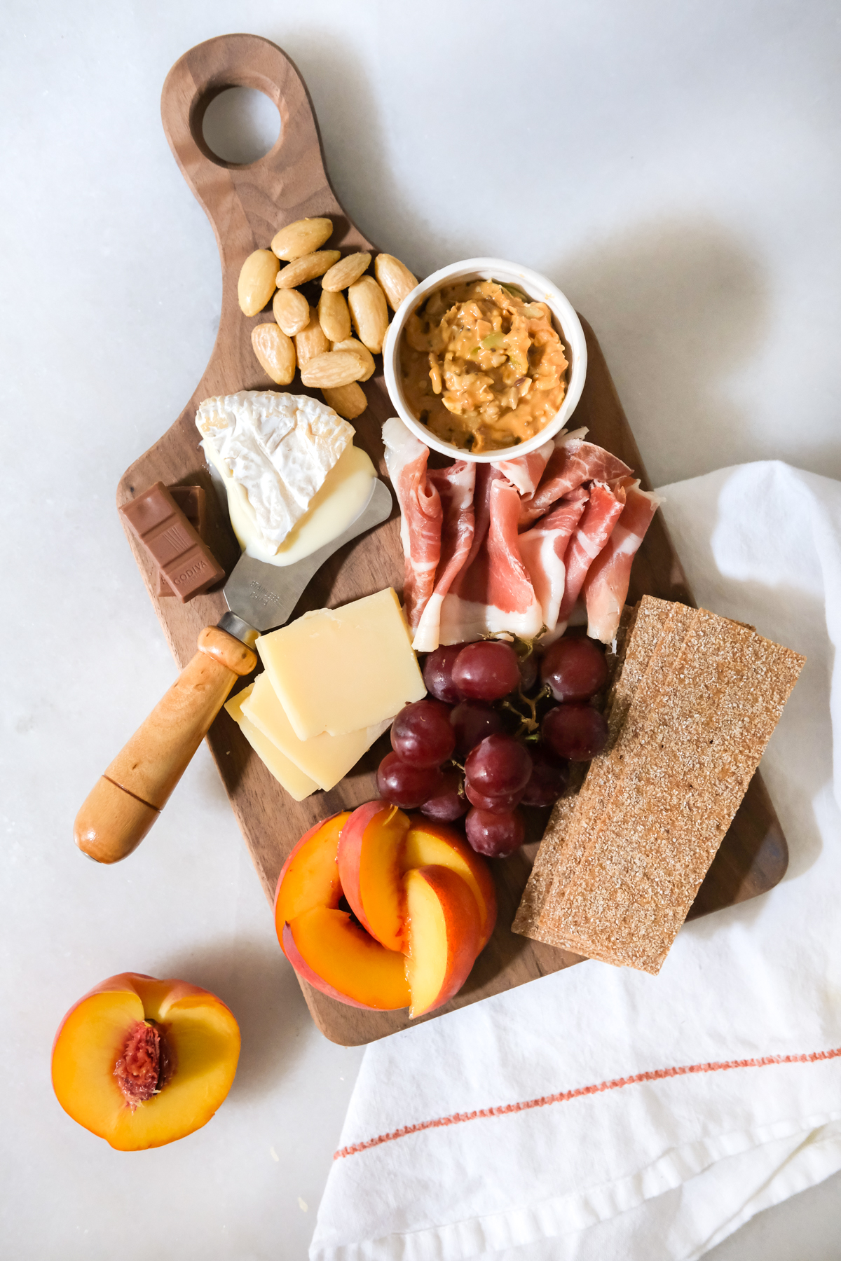 mini charcuterie board for one with fruit and cheese