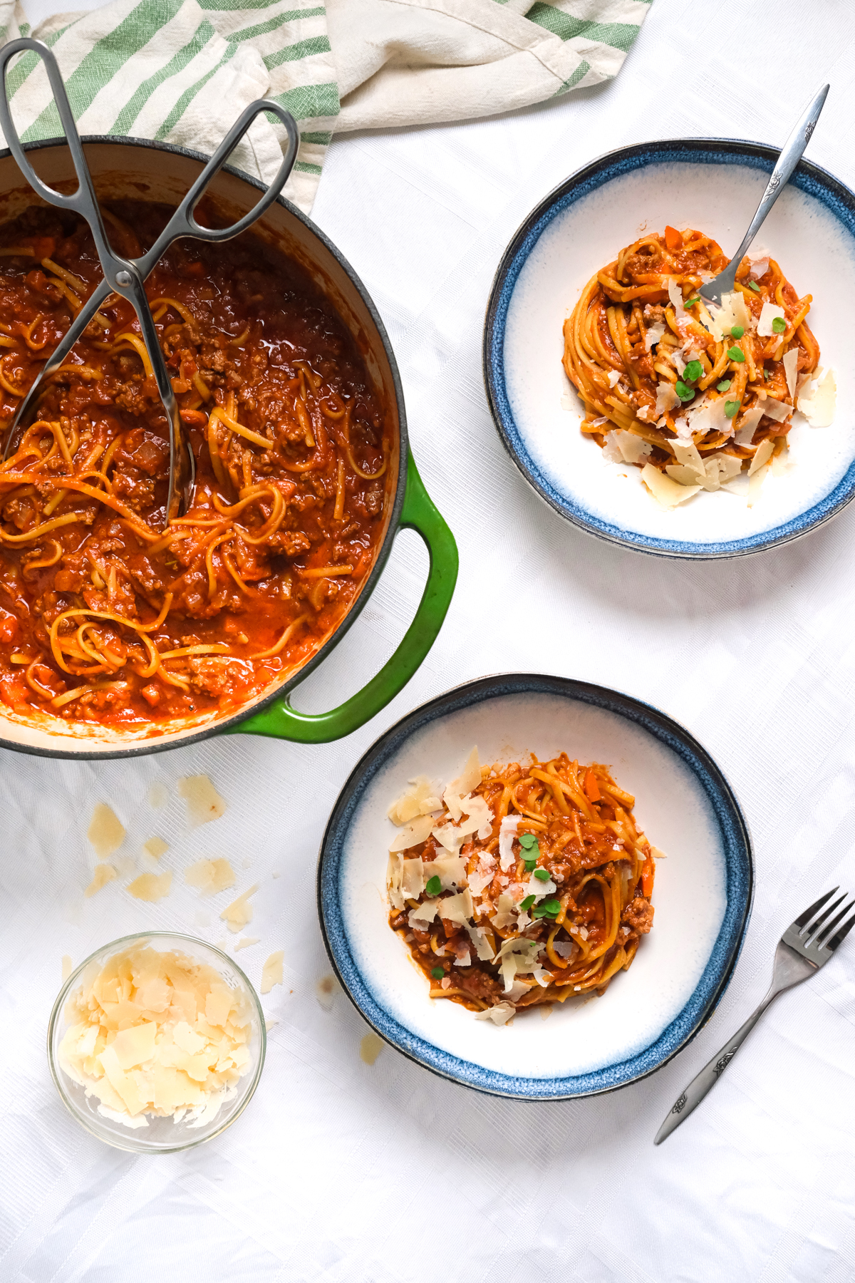 one pot bolognese filling bowls with shredded cheese