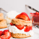 strawberry shortcake with whipped cream on a plate