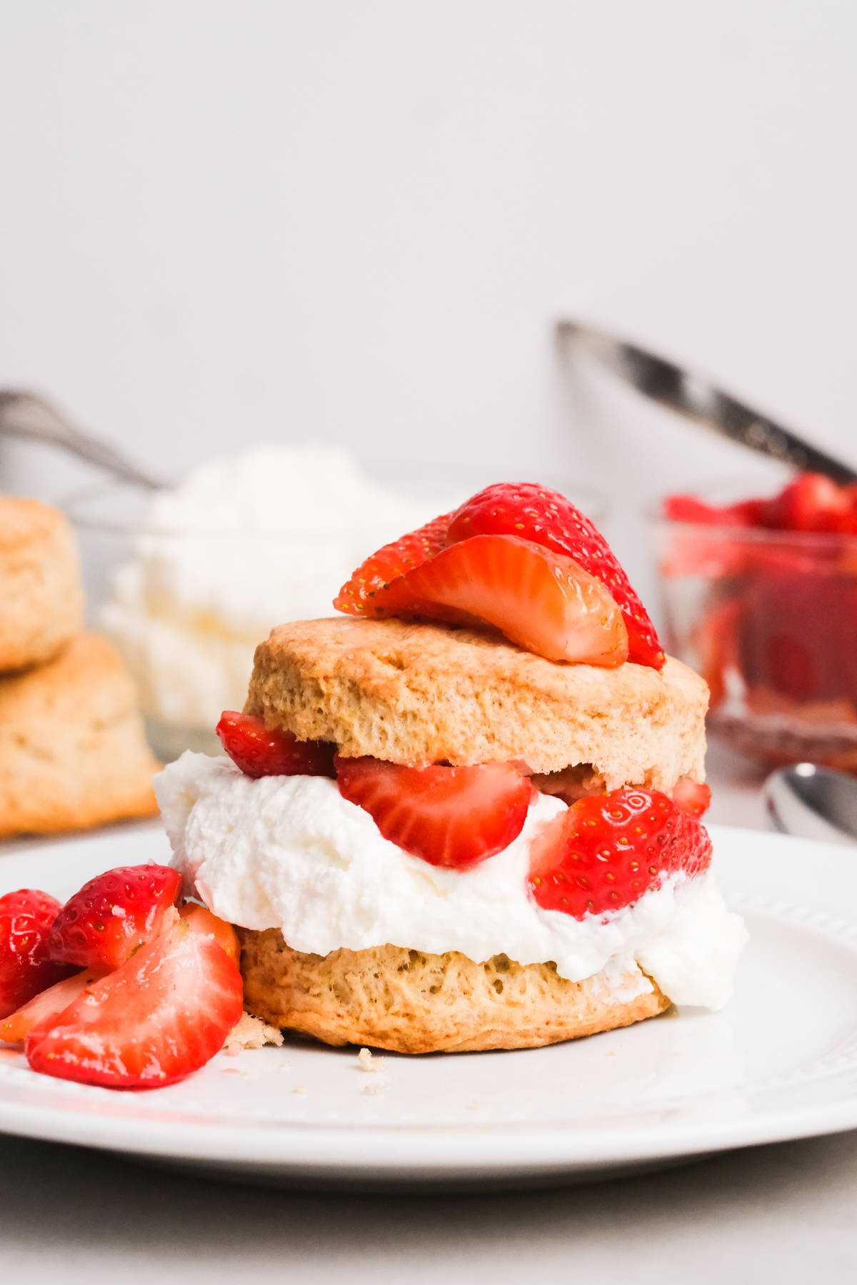 strawberry shortcake with whipped cream on a plate