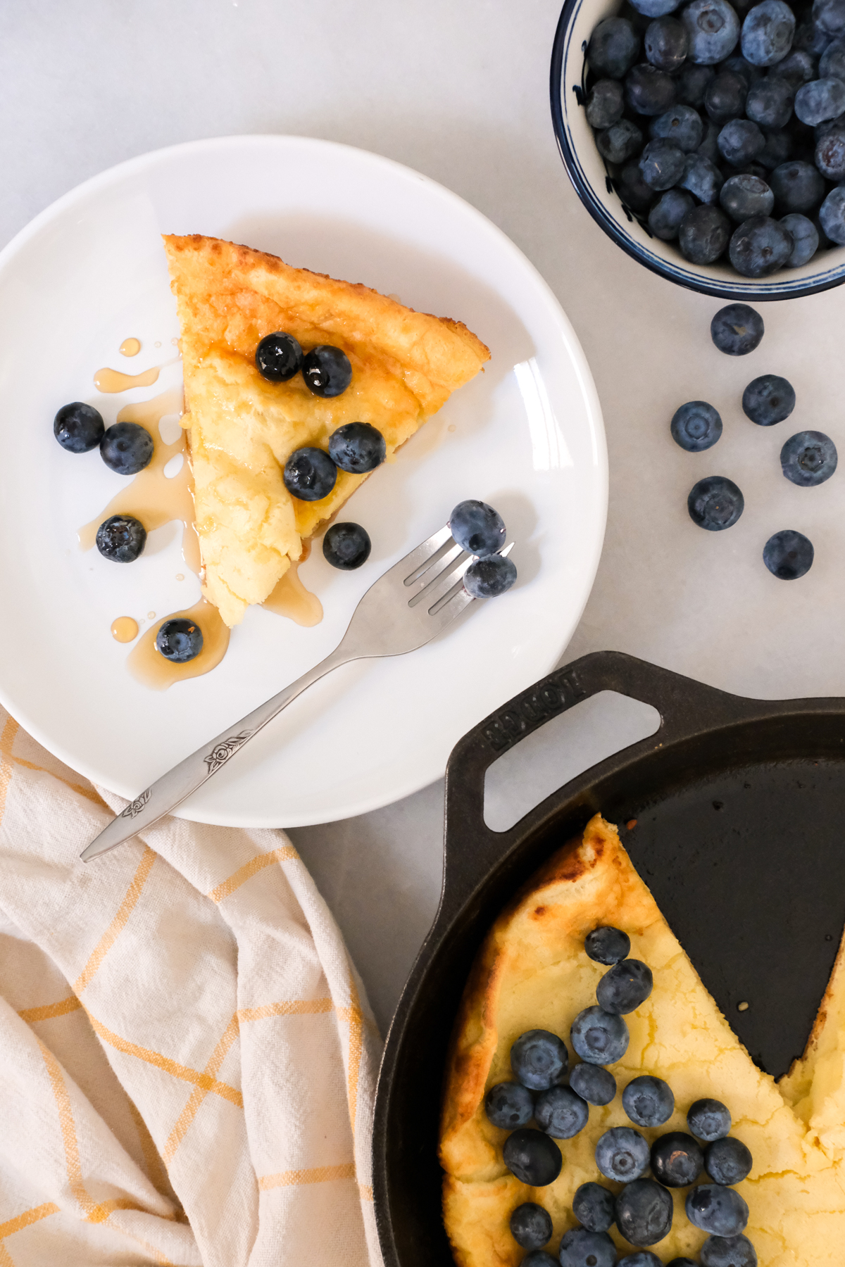 slice of buttermilk dutch baby with blueberries