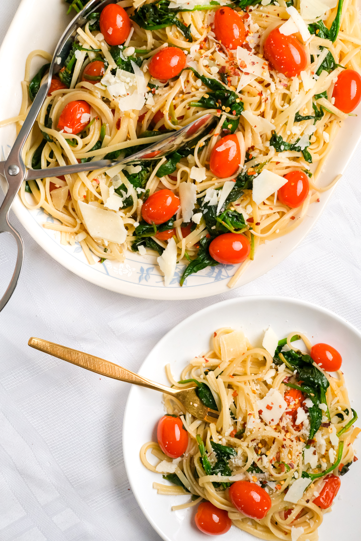 serving lemon garlic vegetable linguini with shaved parmesan and red pepper flakes