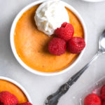 mini pumpkin cheesecake with berries and whipped cream