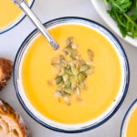 bowl of roasted butternut squash soup with seeds