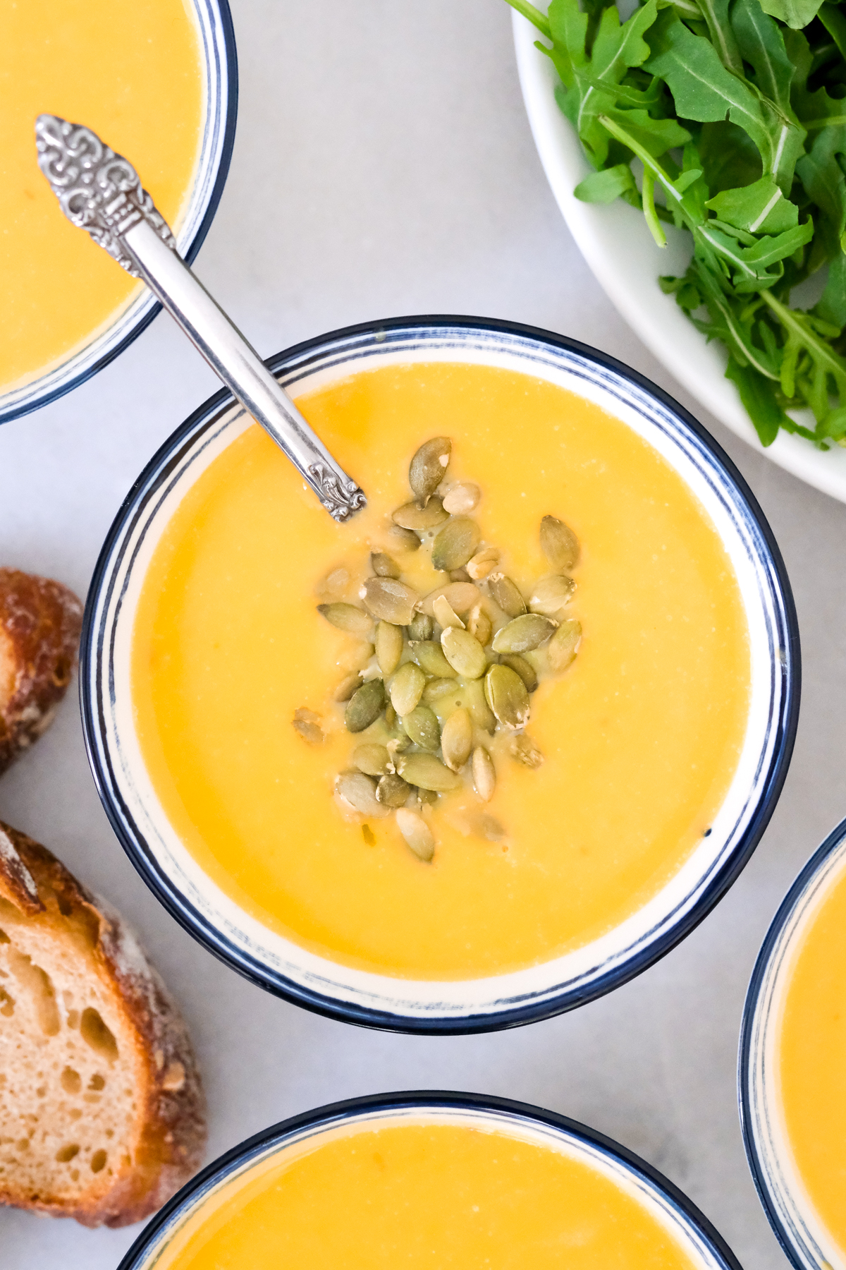 bowl of roasted butternut squash soup with seeds