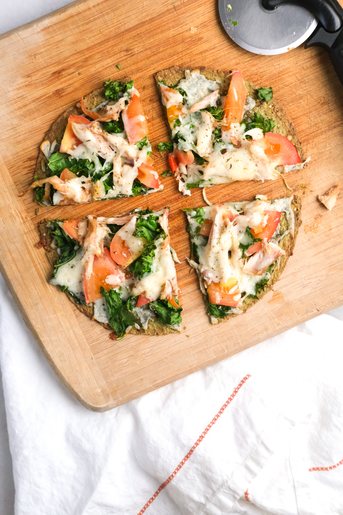 slices of a lunch chicken flatbread with vegetables