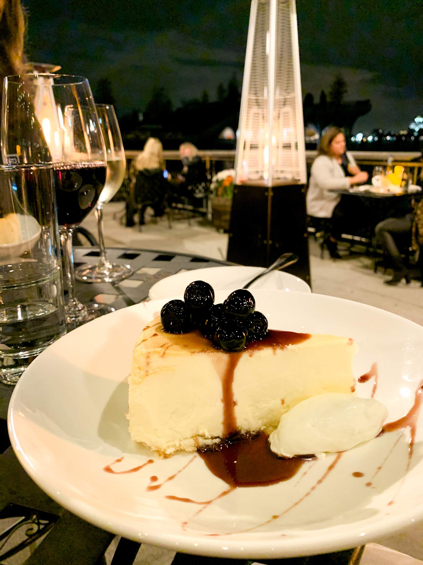 cheesecake with cherries on a patio