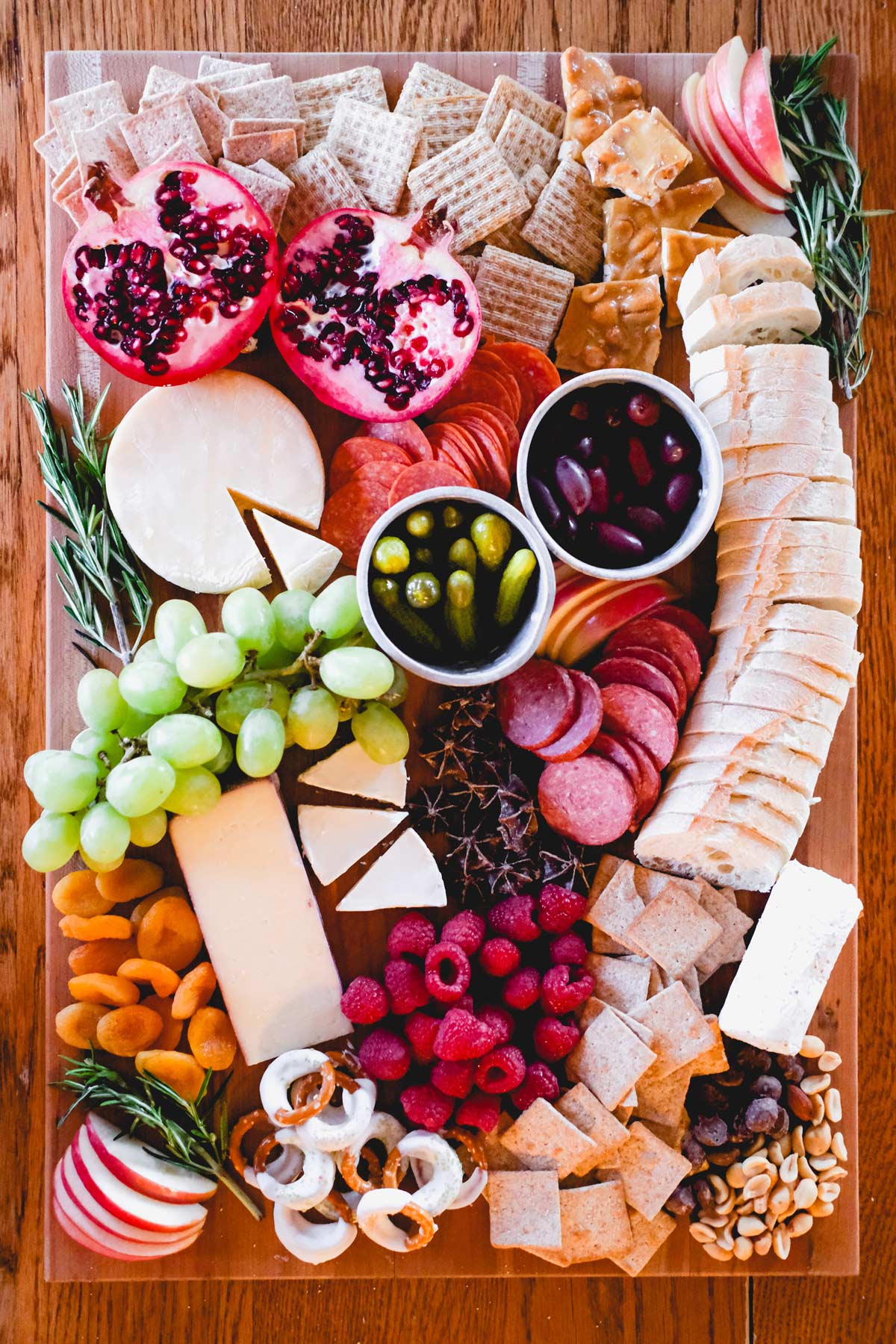 holiday charcuterie board with cheese meat fruit and chocolate