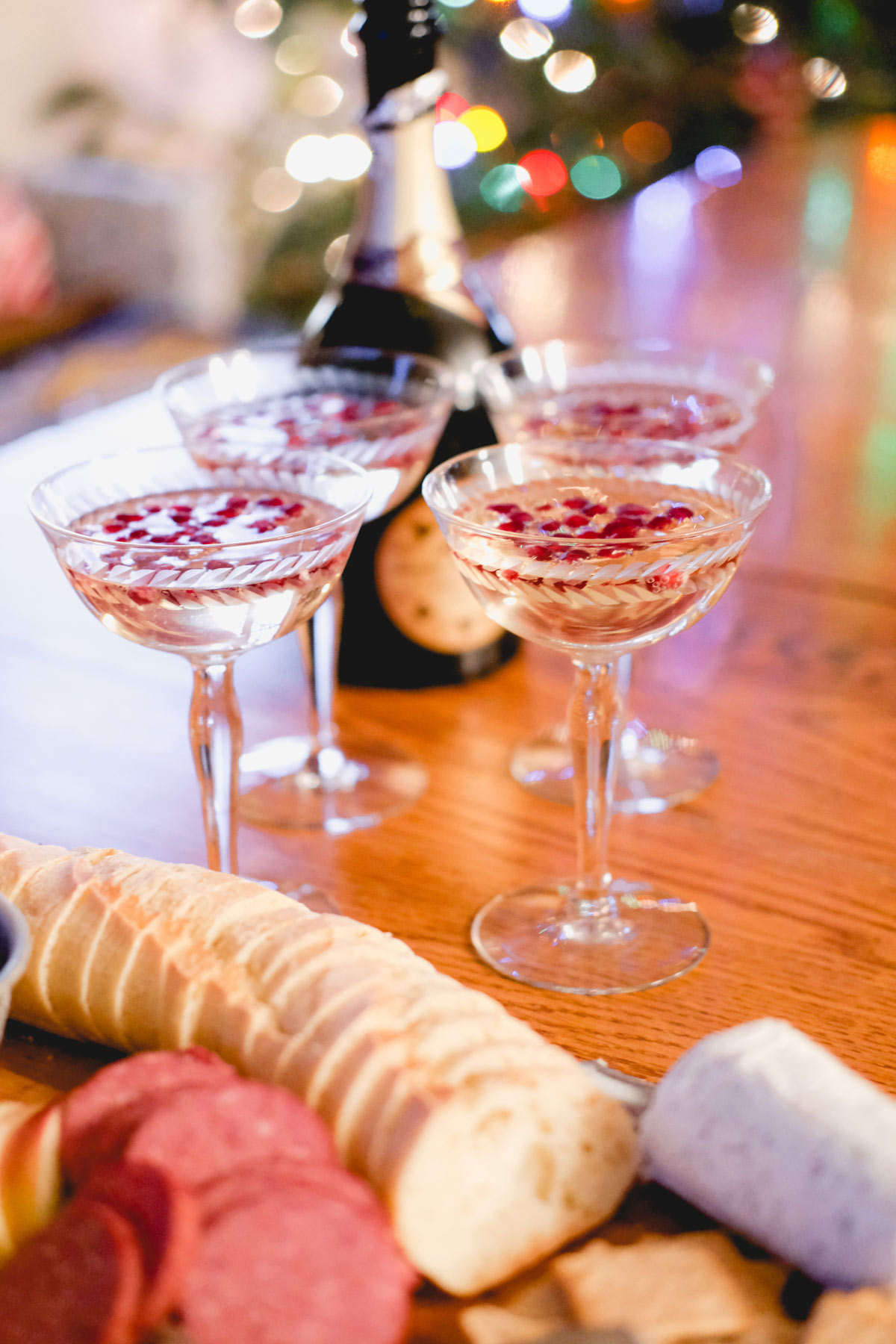 festive prosecco cocktail with charcuterie board