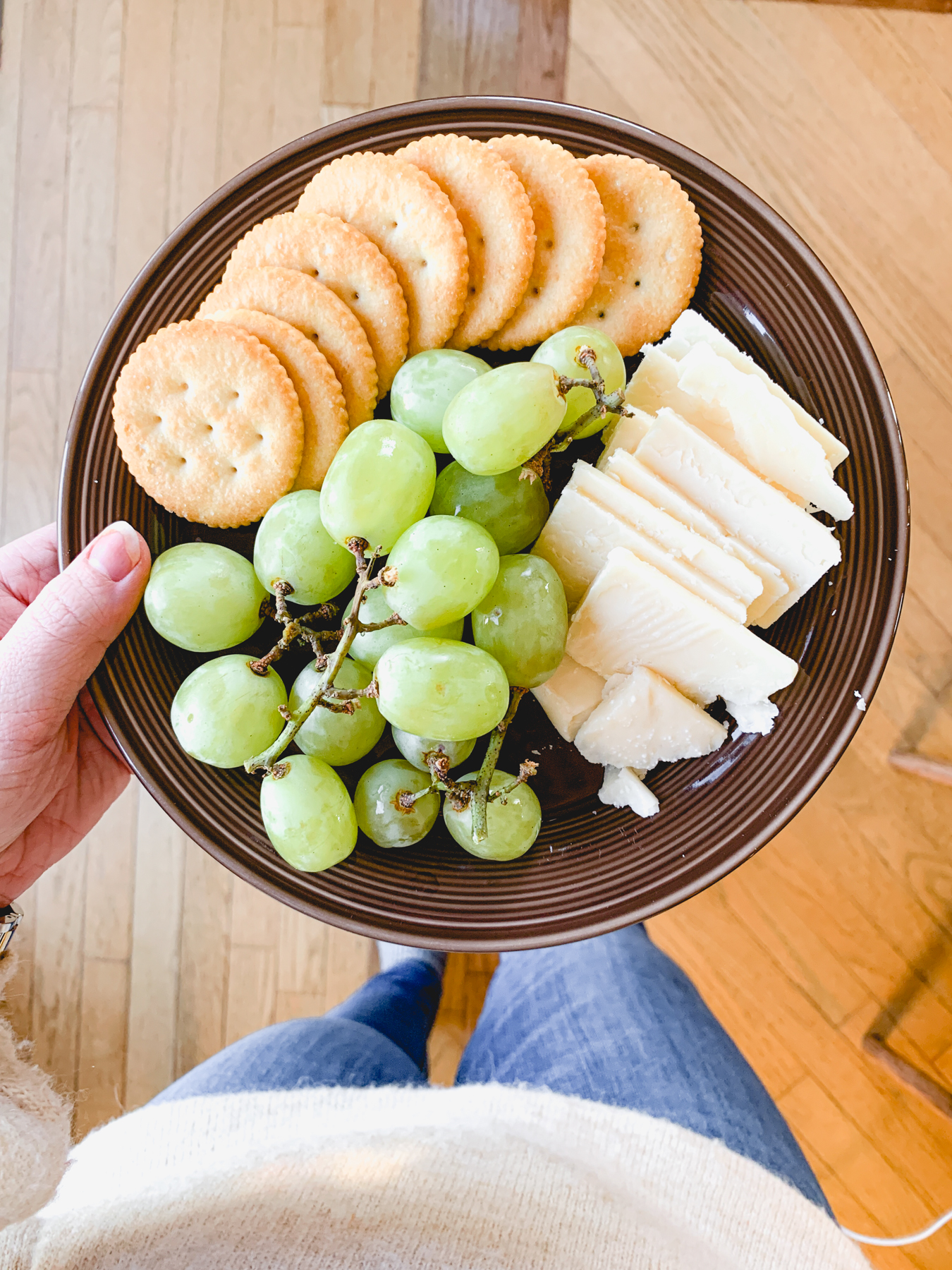 snack plate with cheese crackers and grapes