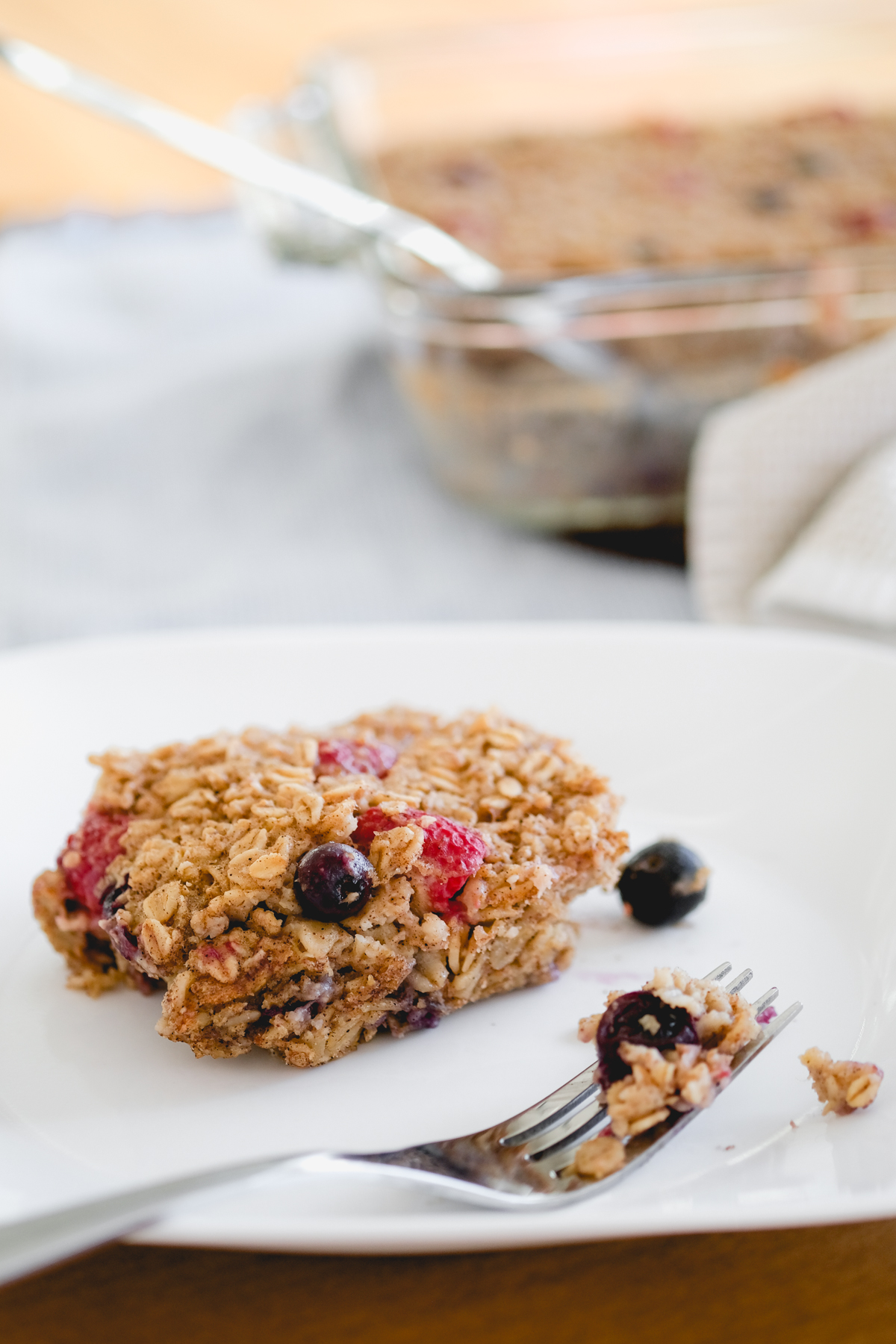 a slice of berry baked oatmeal on a plate