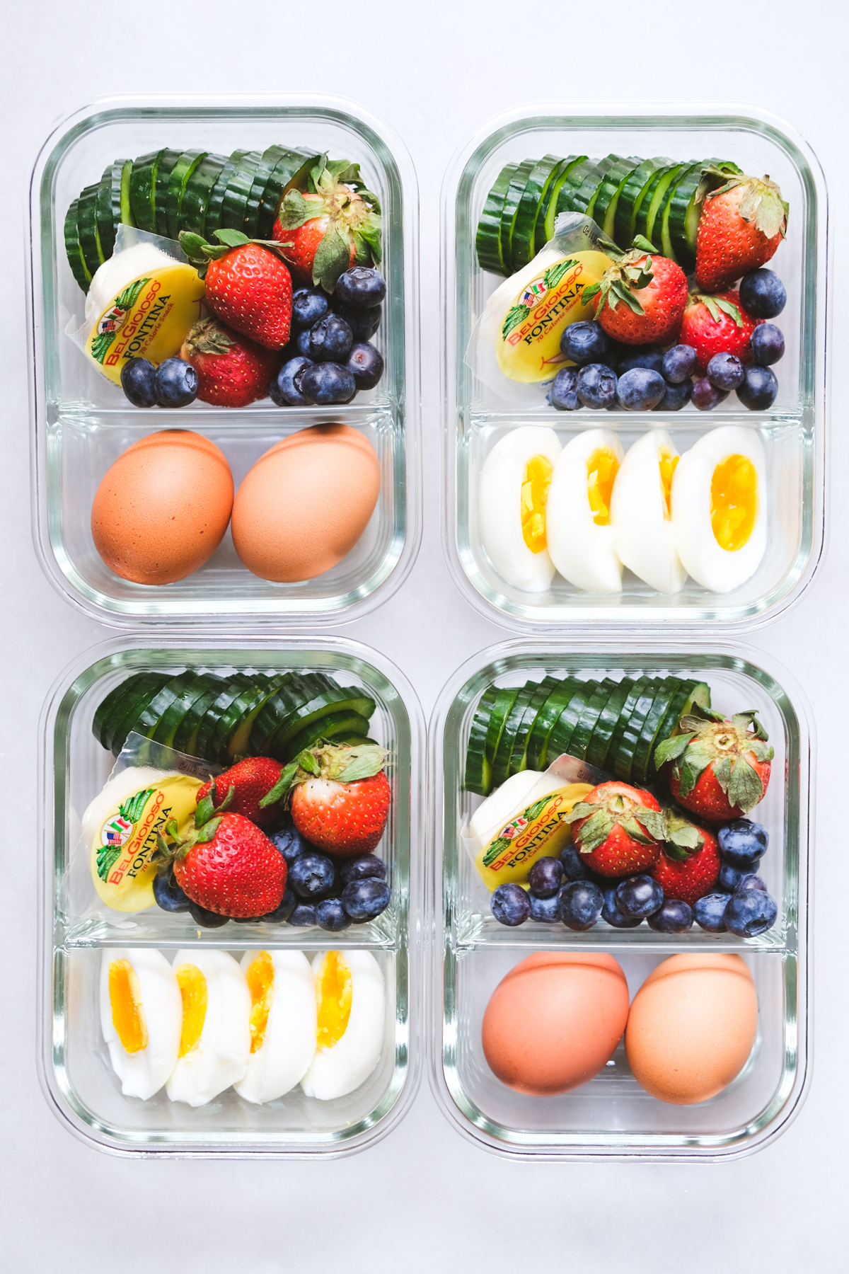 lunch meal prep with eggs cheese fruit and cucumbers