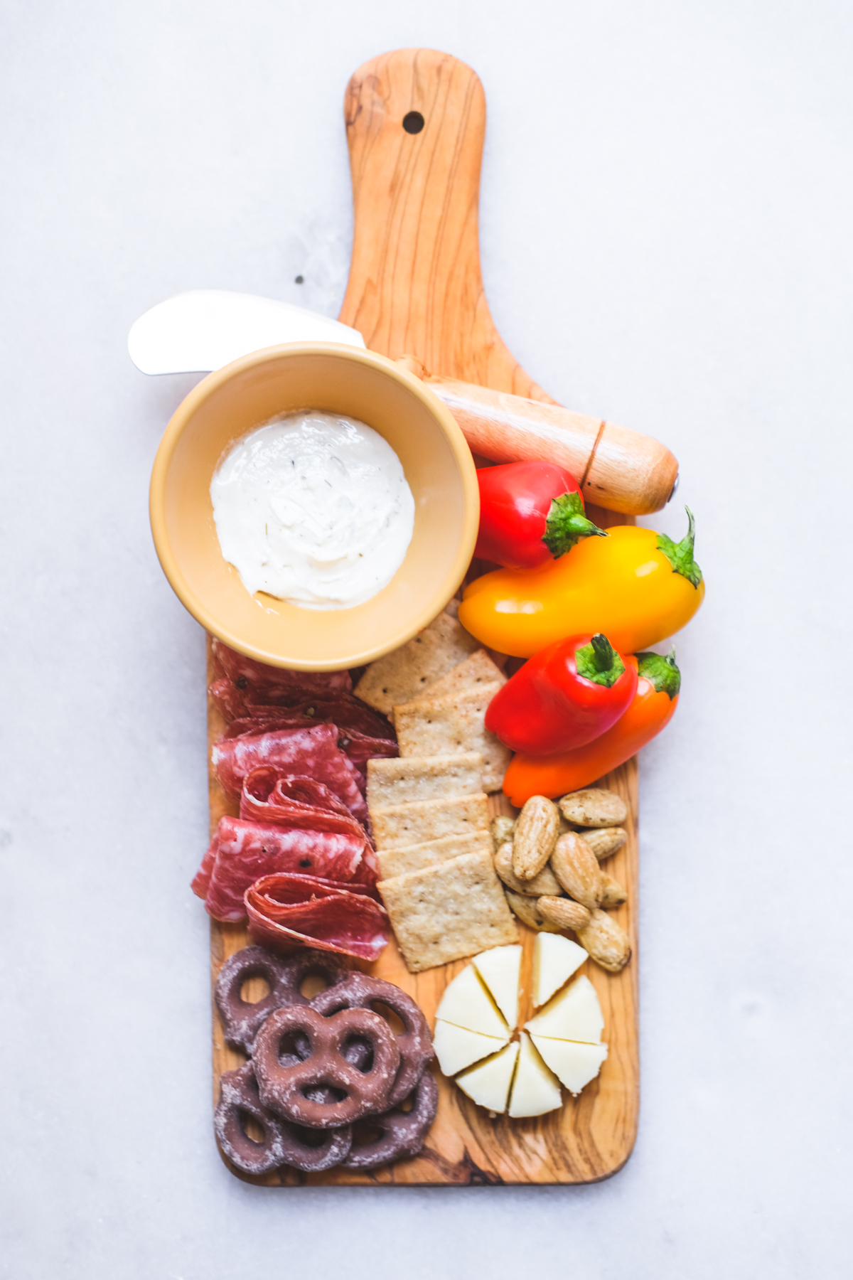 mini charcuterie board with peppers cheese salami and crackers