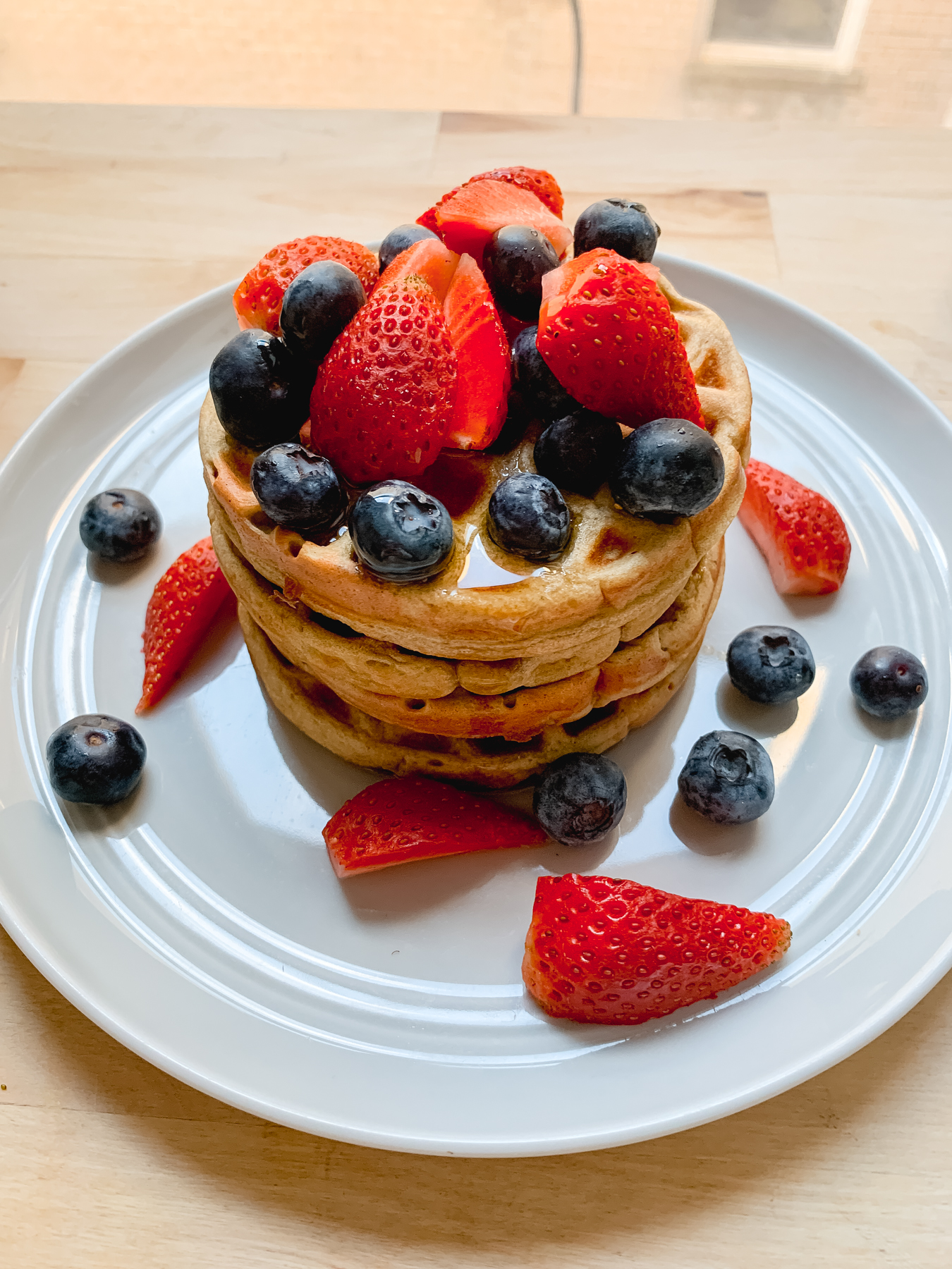protein waffles with berries stacked on top of each other