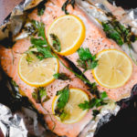 baked salmon with lemon and parsley in tin foil