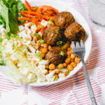 roasted meatballs chickpeas and carrots in a salad with romaine and feta