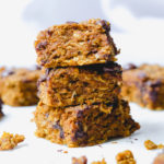 pumpkin chocolate chip oat bars stacked on top of each other