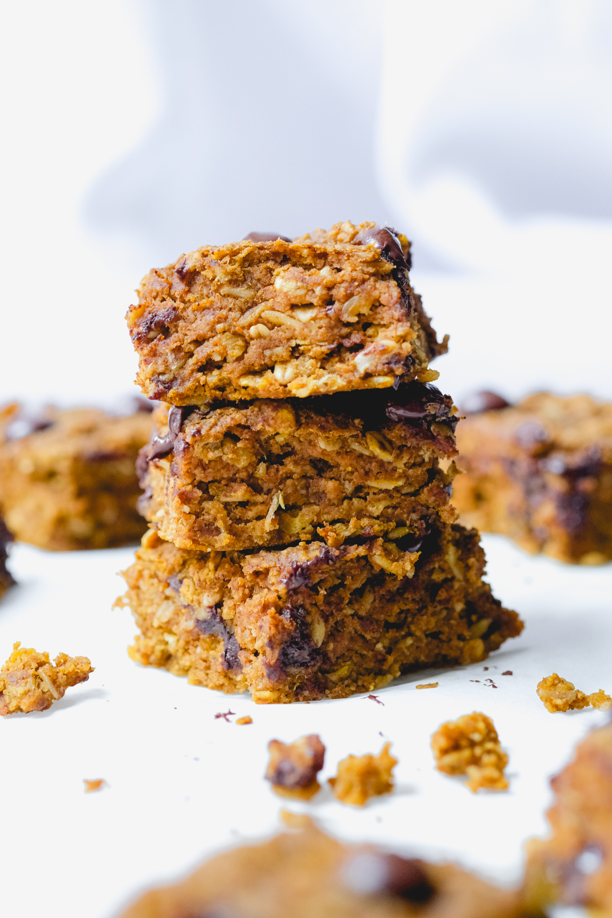 pumpkin chocolate chip oat bars stacked on top of each other
