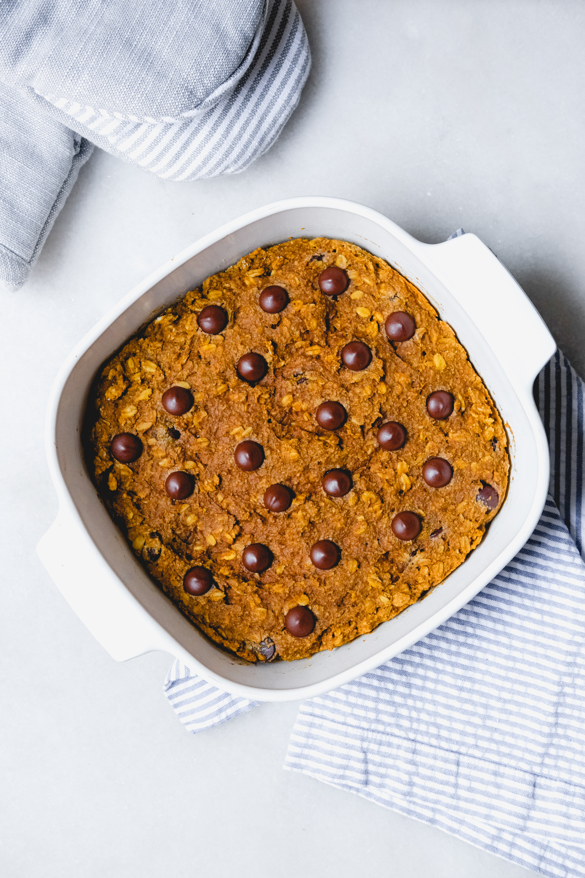 baked pumpkin chocolate chip oat bars in a square dish