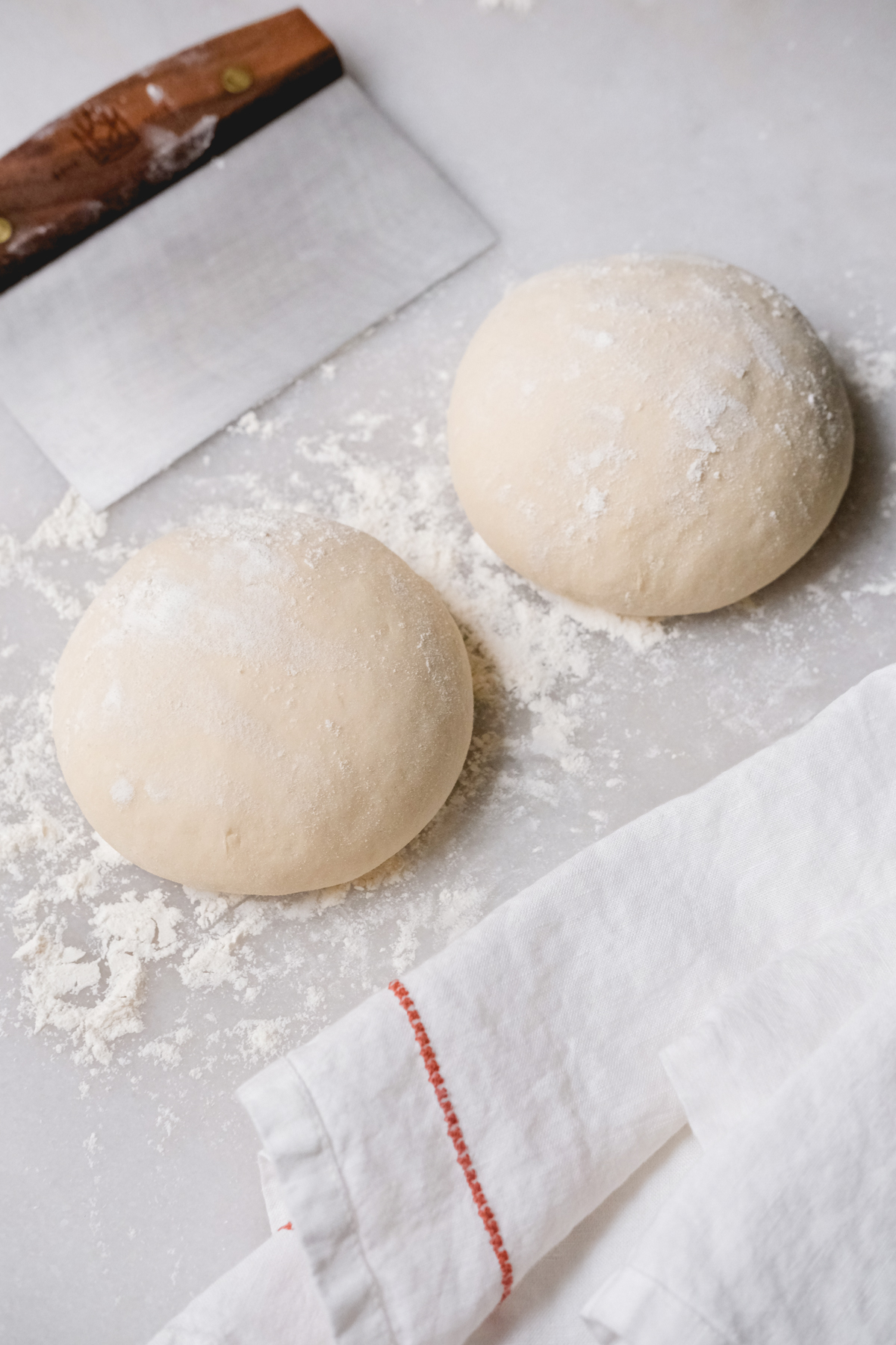 formed pizza dough balls ready for a second rise