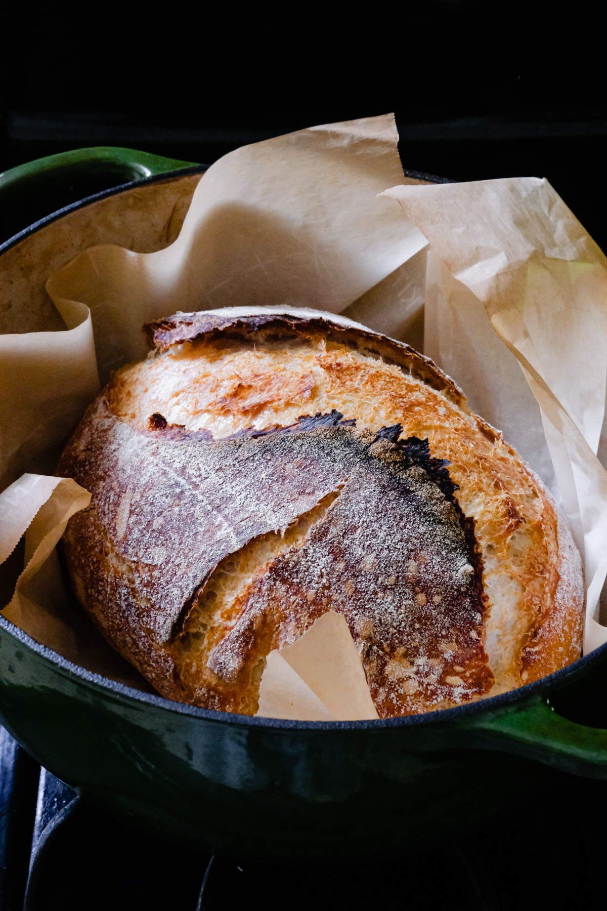 baked sourdough bread in a dutch oven