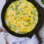 spring green onion asparagus frittata in a cast iron skillet ready to be served